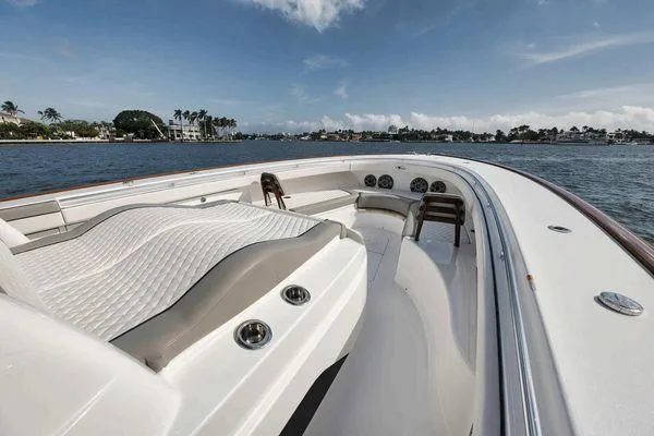 Yacht Photos Pics 2023 Valhalla Boatworks V-46 luxury boat interior with seating, on a sunny day.