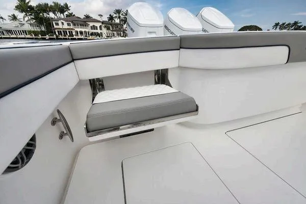  Yacht Photos Pics 2023 Valhalla Boatworks V-46 interior with cushioned seating and sleek design.