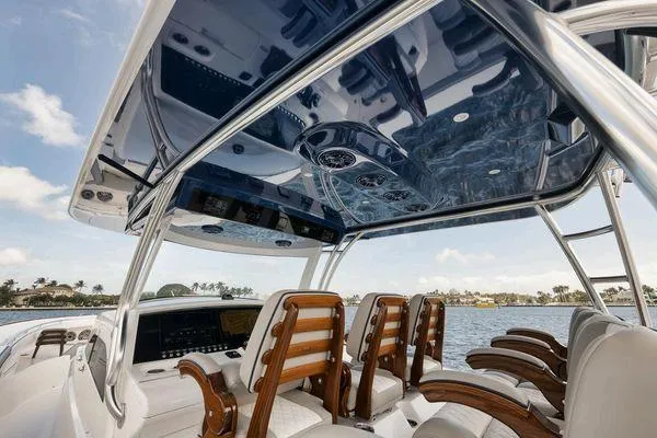  Yacht Photos Pics 2023 Valhalla Boatworks V-46 interior with sleek design and luxurious seating on the water.