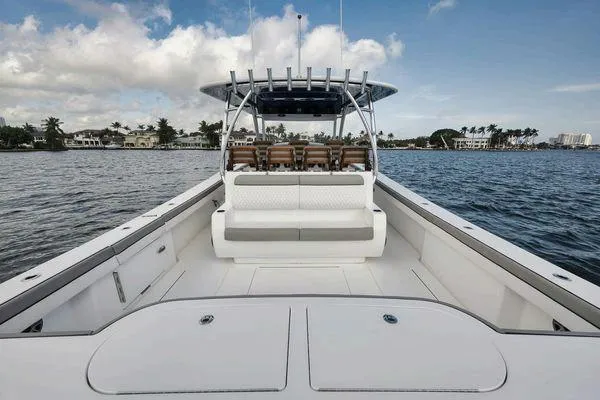  Yacht Photos Pics 2023 Valhalla Boatworks V-46 on water, showcasing spacious deck and seating.
