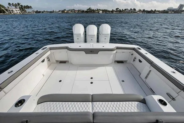  Yacht Photos Pics 2023 Valhalla Boatworks V-46 with spacious deck and triple engines on calm water.