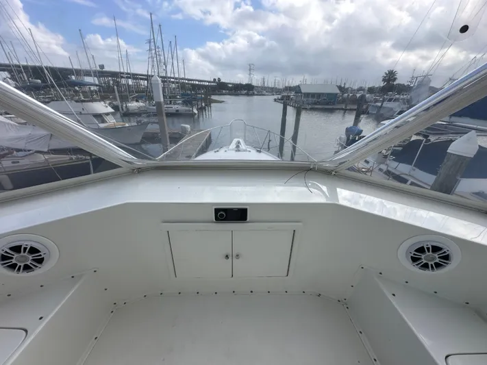 The Godfather Yacht Photos Pics 1986 Hatteras 52 Convertible yacht interior with marina view.