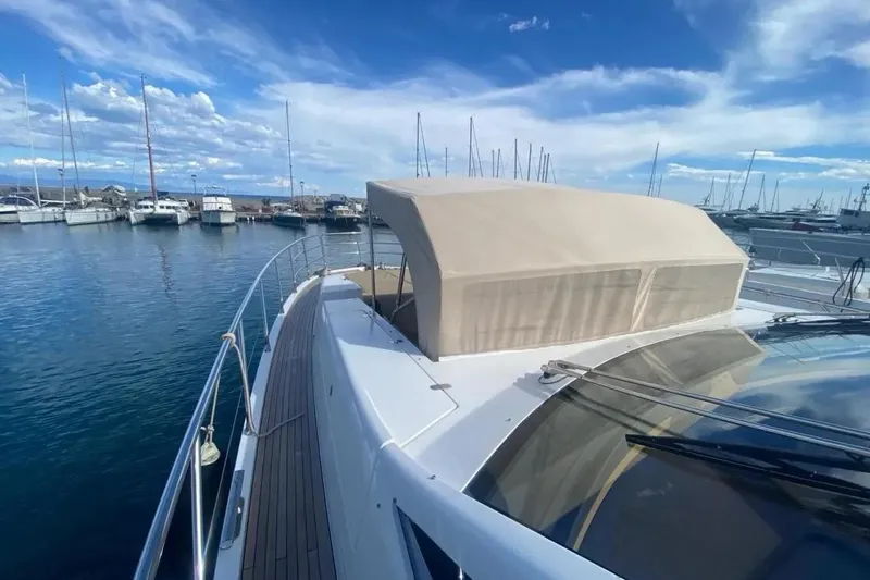 Titta Yacht Photos Pics Luxury Azimut 77S yacht docked in marina, 2016 model, clear blue sky.