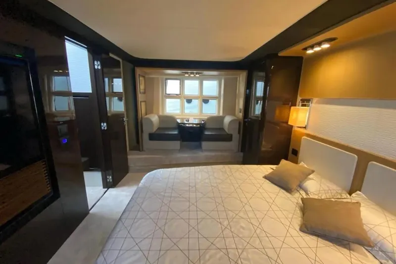 Titta Yacht Photos Pics Luxurious interior of 2016 Azimut 77S yacht with elegant bedroom and seating area.
