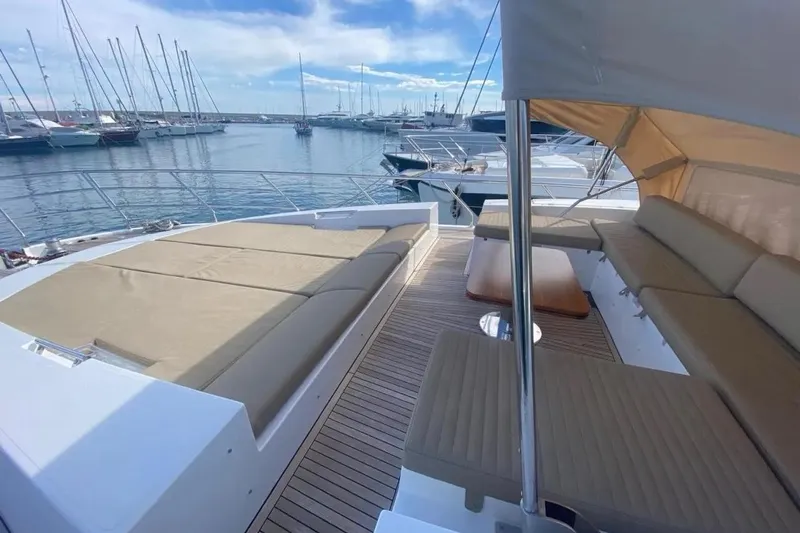 Titta Yacht Photos Pics Luxurious 2016 Azimut 77S yacht deck with comfortable seating and marina view.