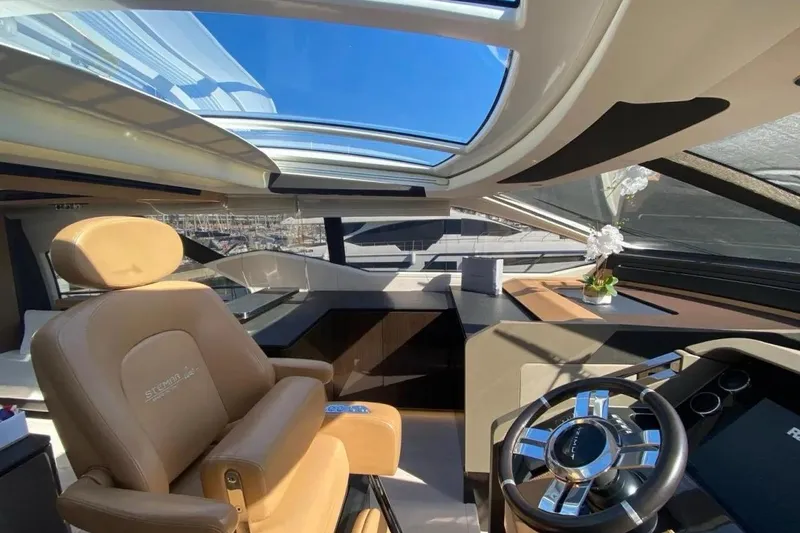 Titta Yacht Photos Pics Luxurious interior of 2016 Azimut 77S yacht with panoramic sunroof and elegant helm station.