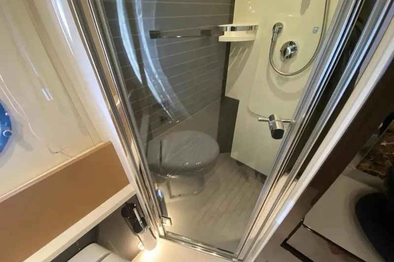 Titta Yacht Photos Pics Bathroom interior of 2016 Azimut 77S yacht with modern shower and fixtures.