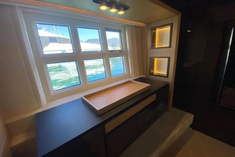 Titta Yacht Photos Pics Luxurious interior of 2016 Azimut 77S yacht with elegant window view and modern lighting.