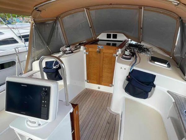 Top O Nok Yacht Photos Pics Cockpit of 2020 Tartan 395 sailboat with navigation equipment and wooden flooring.