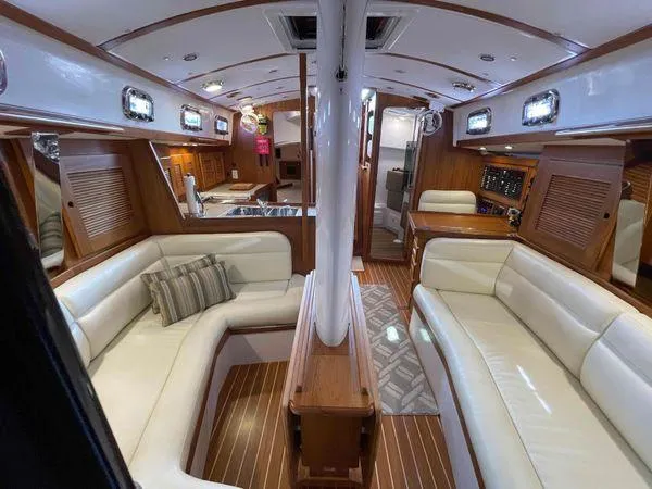 Top O Nok Yacht Photos Pics Luxurious interior of 2020 Tartan 395 yacht with elegant seating and wood finishes.