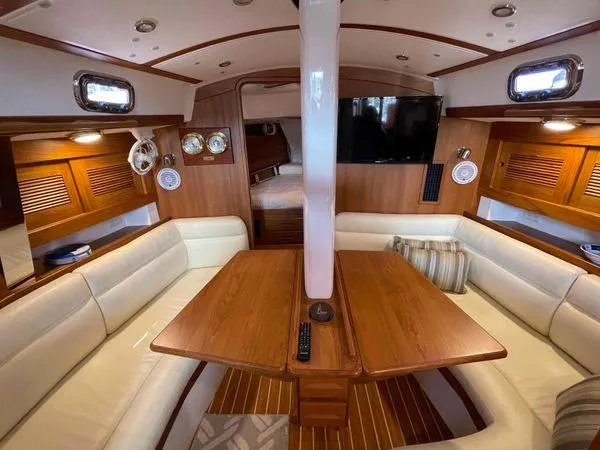 Top O Nok Yacht Photos Pics Luxurious interior of 2020 Tartan 395 yacht with wood finish and plush seating.