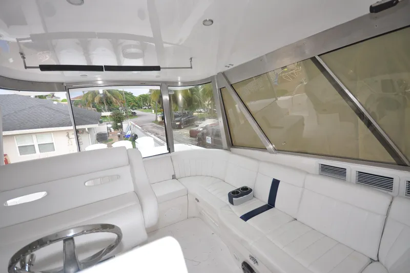  Yacht Photos Pics Interior of 2009 Intrepid 430 Sport Yacht with white seating and panoramic windows.