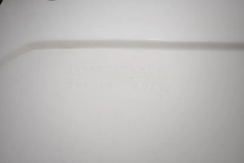  Yacht Photos Pics Embossed text on white surface of 2009 Intrepid 430 Sport Yacht Kevlar hull.