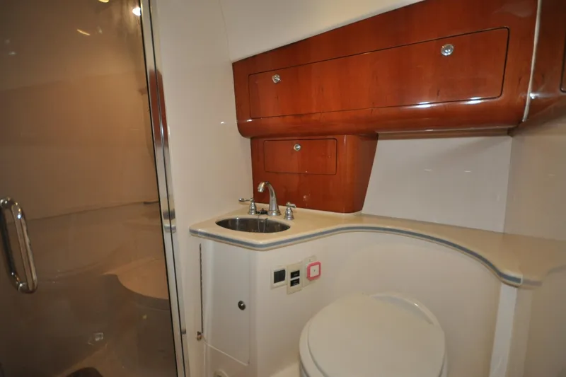 Yacht Photos Pics Luxurious bathroom interior of 2009 Intrepid 430 Sport Yacht with wooden cabinetry.