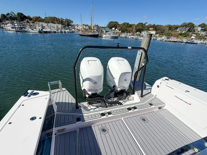  Yacht Photos Pics 2022 Axopar 37 Sun Top with dual engines docked in a scenic marina.