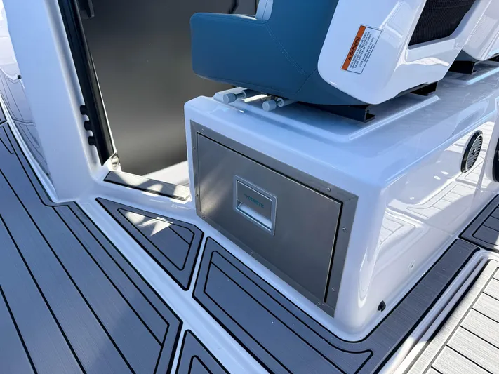  Yacht Photos Pics 2022 Axopar 37 Sun Top boat interior with sleek seating and storage compartment.