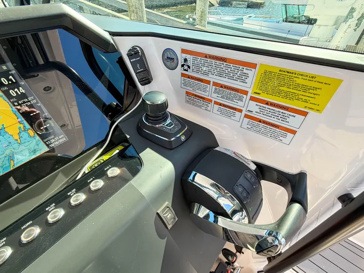  Yacht Photos Pics Axopar 37 Sun Top 2022 helm with controls and navigation display.