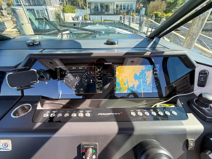  Yacht Photos Pics 2022 Axopar 37 Sun Top dashboard with navigation screens and controls.