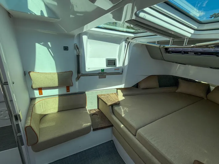 Yacht Photos Pics Interior of 2022 Axopar 37 Sun Top with cozy seating and modern design.