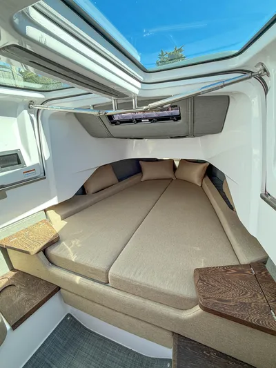  Yacht Photos Pics Luxurious interior of 2022 Axopar 37 Sun Top with spacious bed and modern design.