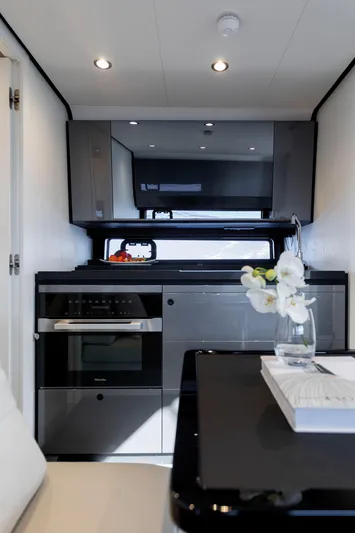 Yacht Photos Pics Luxurious interior of 2024 Azimut Verve 48 yacht with modern kitchen amenities.