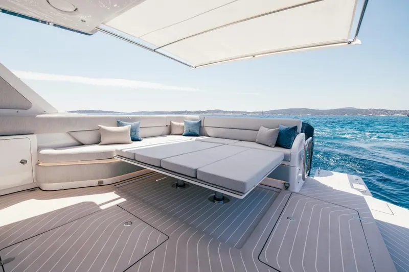  Yacht Photos Pics Luxurious 2024 Azimut Verve 48 yacht deck with elegant seating and ocean view.