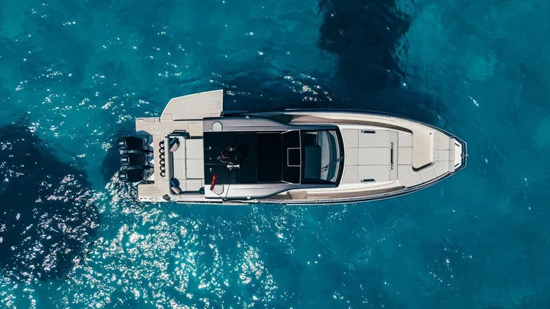  Yacht Photos Pics 2024 Azimut Verve 48 yacht on clear blue water, aerial view.