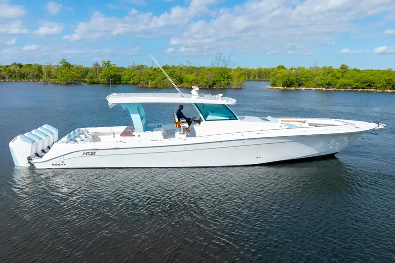  Yacht Photos Pics 2026 HCB 56 Suenos GIX luxury boat on calm water, clear sky background.
