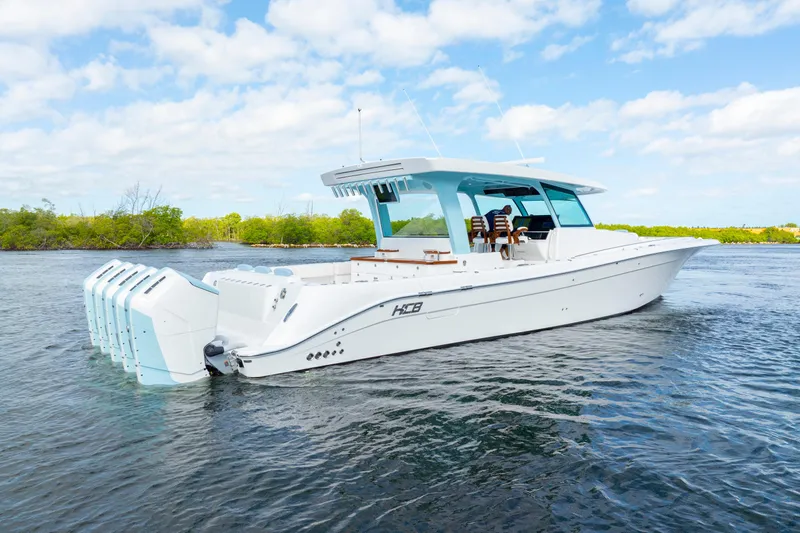  Yacht Photos Pics 2026 HCB 56 Suenos GIX luxury boat on water, featuring multiple outboard engines.