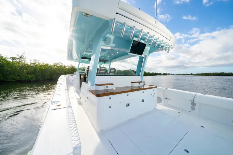  Yacht Photos Pics 2026 HCB 56 Suenos GIX luxury boat on calm water, clear sky background.