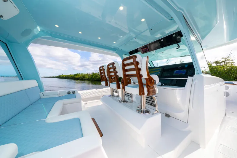  Yacht Photos Pics Luxurious interior of 2026 HCB 56 Suenos GIX yacht with plush seating and modern helm.