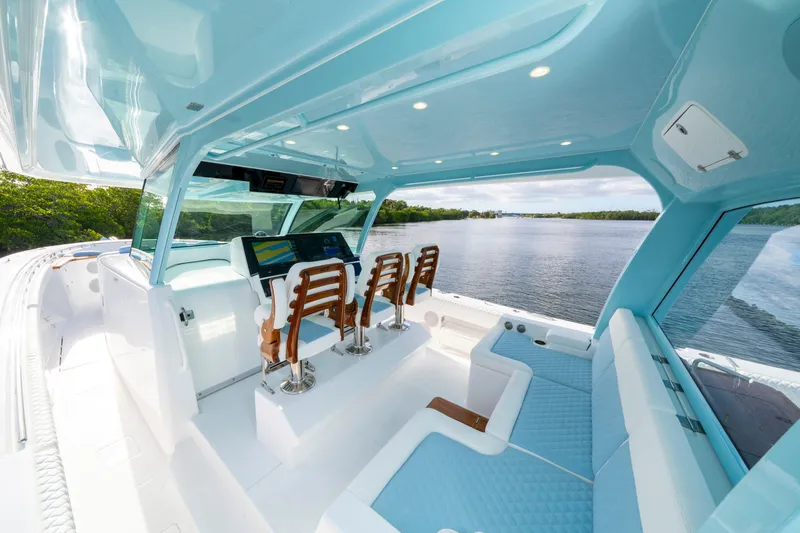  Yacht Photos Pics Luxurious 2026 HCB 56 Suenos GIX boat interior with blue seating and advanced navigation system.