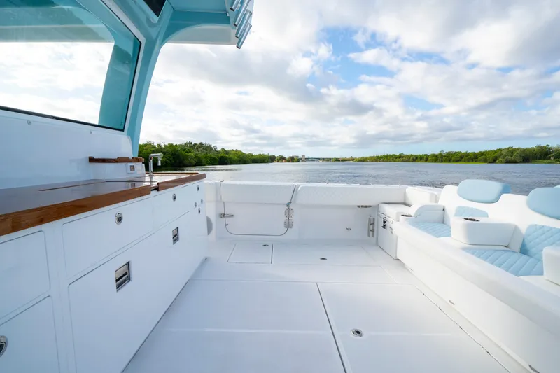  Yacht Photos Pics Luxurious deck of 2026 HCB 56 Suenos GIX yacht with scenic water view.