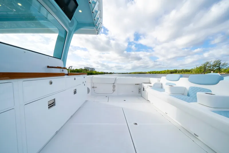  Yacht Photos Pics 2026 HCB 56 Suenos GIX yacht deck with luxurious seating and scenic water view.