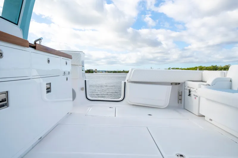  Yacht Photos Pics Luxurious deck of 2026 HCB 56 Suenos GIX yacht with scenic water view.