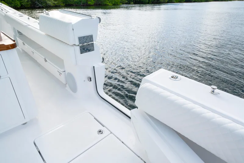  Yacht Photos Pics 2026 HCB 56 Suenos GIX yacht deck with luxurious seating and water view.