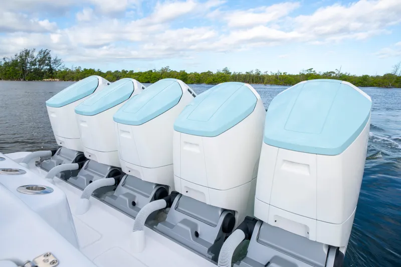  Yacht Photos Pics Four powerful outboard engines on a 2026 HCB 56 Suenos GIX boat, cruising on water.