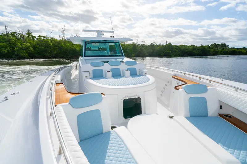  Yacht Photos Pics Luxurious 2026 HCB 56 Suenos GIX yacht with elegant seating and scenic water view.