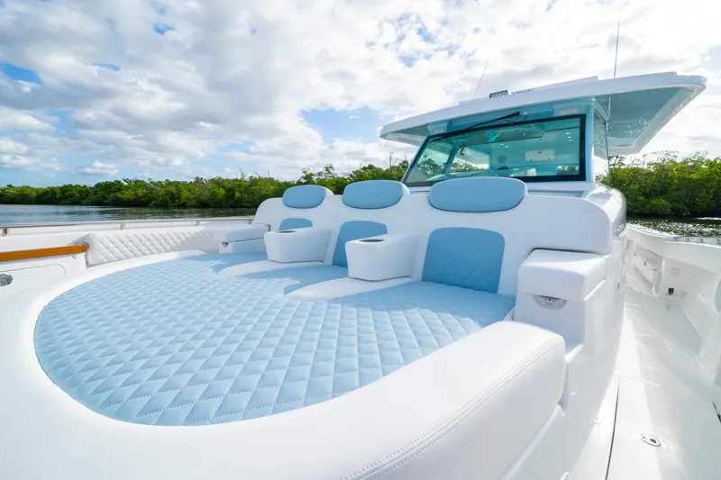  Yacht Photos Pics 2026 HCB 56 Suenos GIX luxury yacht with plush seating and sleek design on a sunny day.