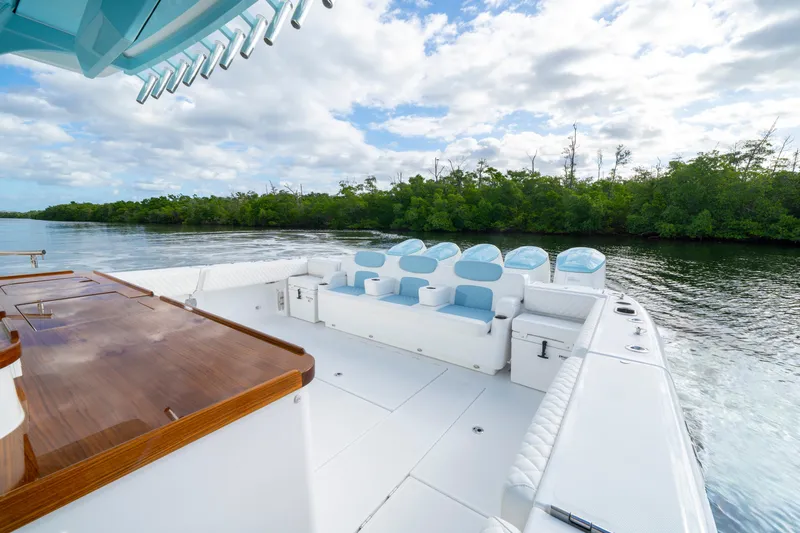  Yacht Photos Pics 2026 HCB 56 Suenos GIX luxury boat cruising on a scenic waterway.