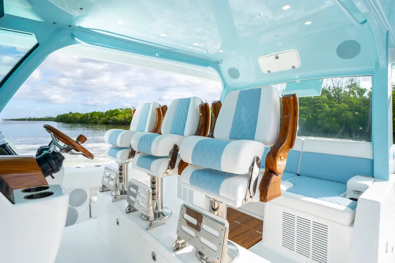  Yacht Photos Pics Luxurious interior of 2026 HCB 56 Suenos GIX yacht with elegant seating and steering wheel.