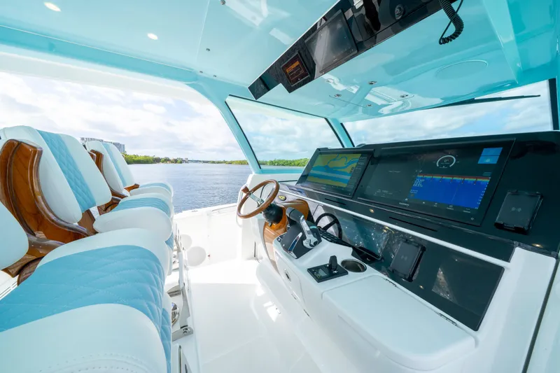  Yacht Photos Pics Luxurious helm of 2026 HCB 56 Suenos GIX with advanced navigation displays and plush seating.