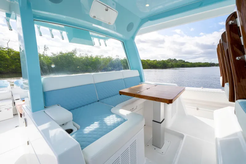  Yacht Photos Pics Luxurious seating area on 2026 HCB 56 Suenos GIX yacht with scenic water view.