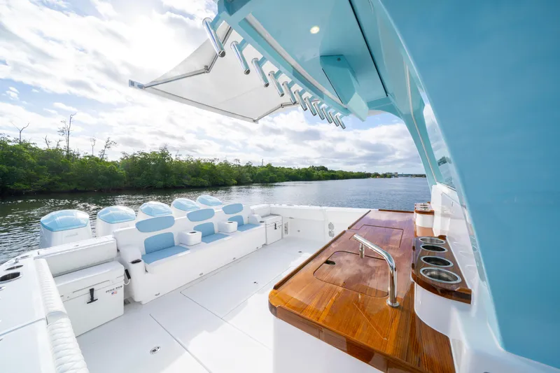  Yacht Photos Pics Luxury deck of 2026 HCB 56 Suenos GIX yacht with seating and bar area.