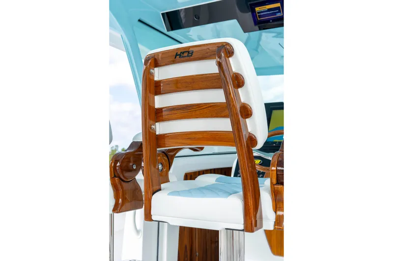  Yacht Photos Pics Luxury wooden helm chair on 2026 HCB 56 Suenos GIX boat.
