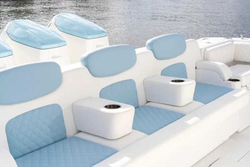  Yacht Photos Pics Luxurious seating on 2026 HCB 56 Suenos GIX boat with blue and white upholstery.