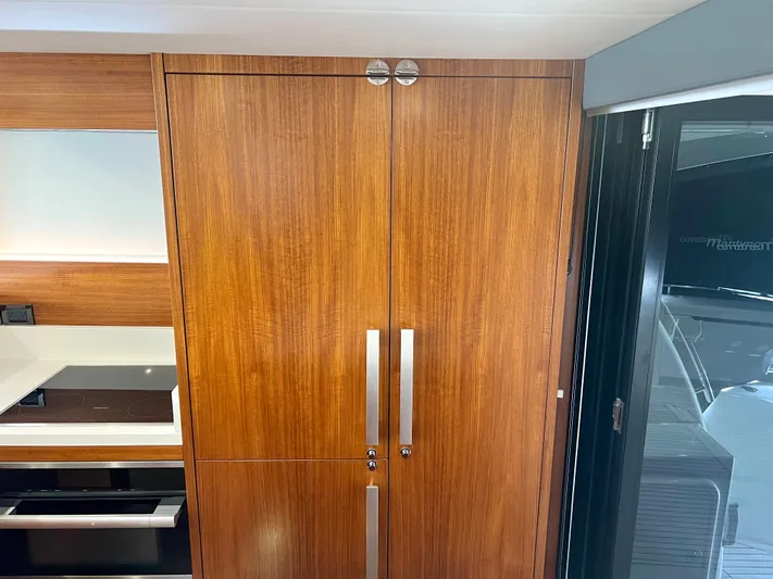  Yacht Photos Pics Wooden cabinetry in the 2020 Maritimo M51 yacht interior, featuring sleek handles and modern design.
