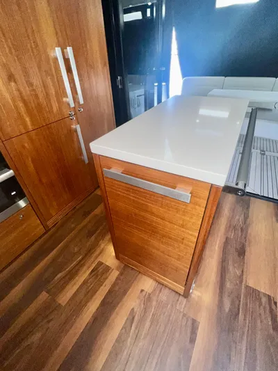  Yacht Photos Pics 2020 Maritimo M51 yacht interior with modern wood cabinetry and sleek countertops.