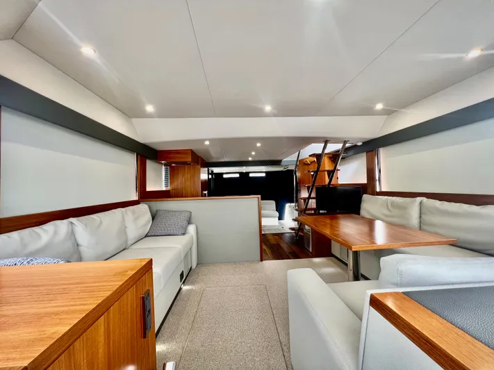  Yacht Photos Pics Luxurious interior of 2020 Maritimo M51 yacht with elegant seating and wooden accents.