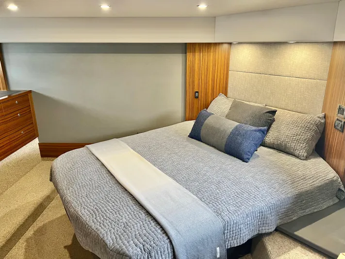  Yacht Photos Pics 2020 Maritimo M51 yacht bedroom with modern decor and cozy bedding.
